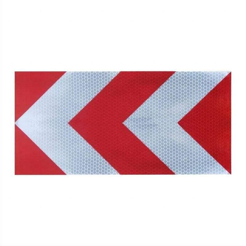 Red and white reflective warning sticker with left-pointing chevrons