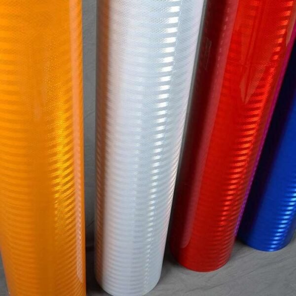 Close-up of yellow, white and red prismatic reflective rolls