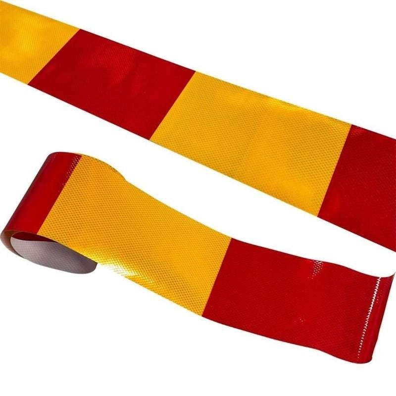 Red and yellow reflective strip with white backing detail