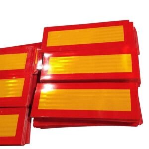 Rectangular yellow reflective rear marker panels with red borders