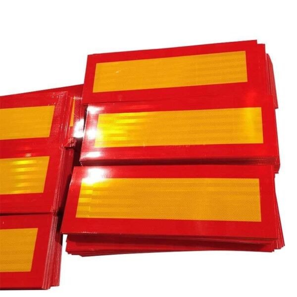 Rectangular yellow reflective rear marker panels with red borders