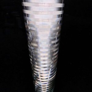 Close-up of white non-adhesive reflective film illuminated against a dark background