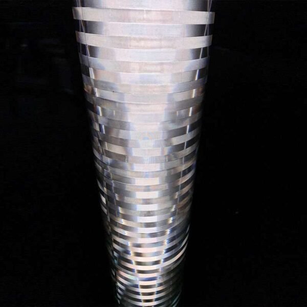 Close-up of white non-adhesive reflective film illuminated against a dark background