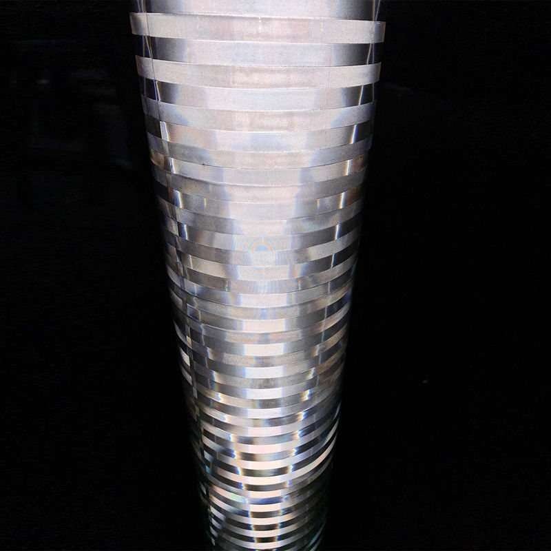 Close-up of white non-adhesive reflective film illuminated against a dark background