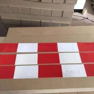 Red and white reflective barrier strips shown in full lengths