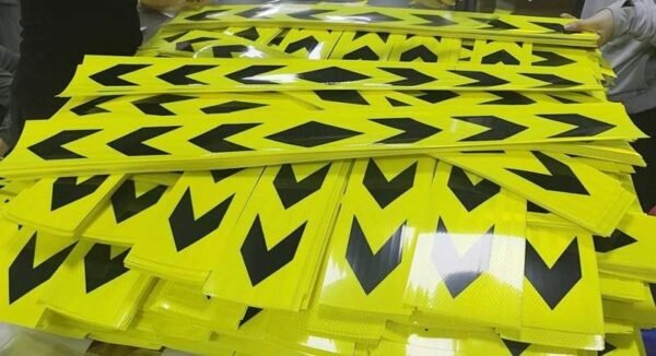 Fluorescent yellow-green and black arrow strips in a full layout