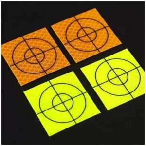 Orange and fluorescent yellow reflective survey targets with black crosshair markings