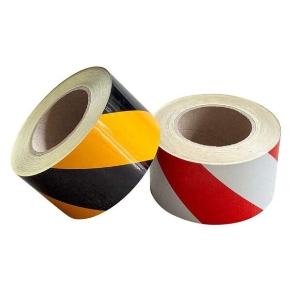 Angled view of yellow black and red white warning tape rolls