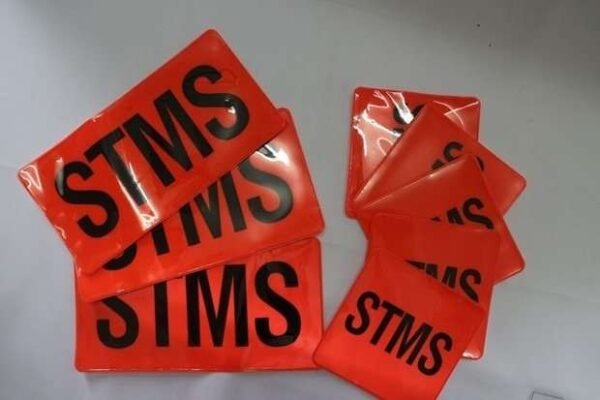 Example of black lettering on orange reflective patches