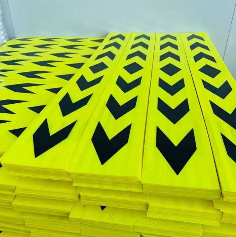 Fluorescent yellow and black directional arrow strips stacked for supply
