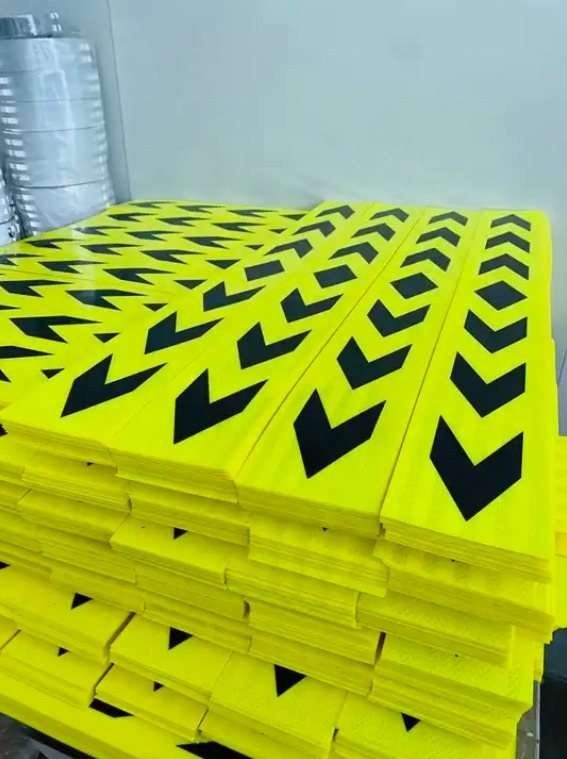 Stacked reflective arrow strips viewed from the side