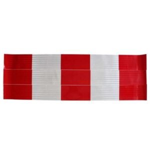 Red and white reflective barrier strips laid flat