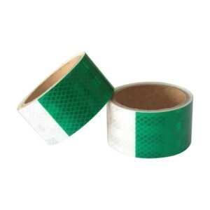 Green and white prismatic reflective tape rolls viewed from above