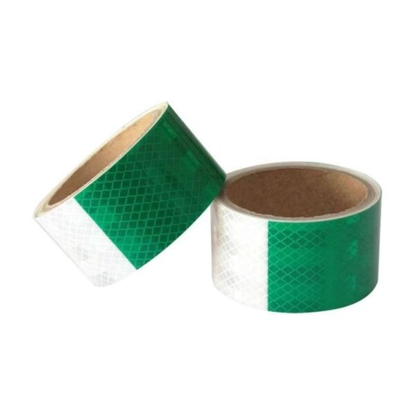 Green and white prismatic reflective tape rolls viewed from above
