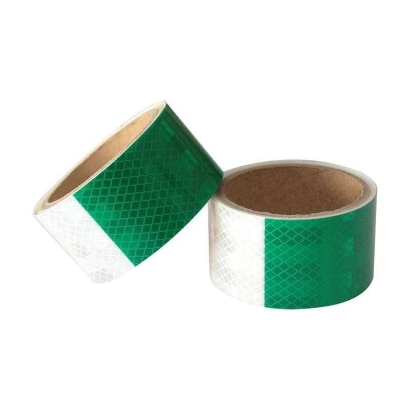 Green and white prismatic reflective tape rolls viewed from above