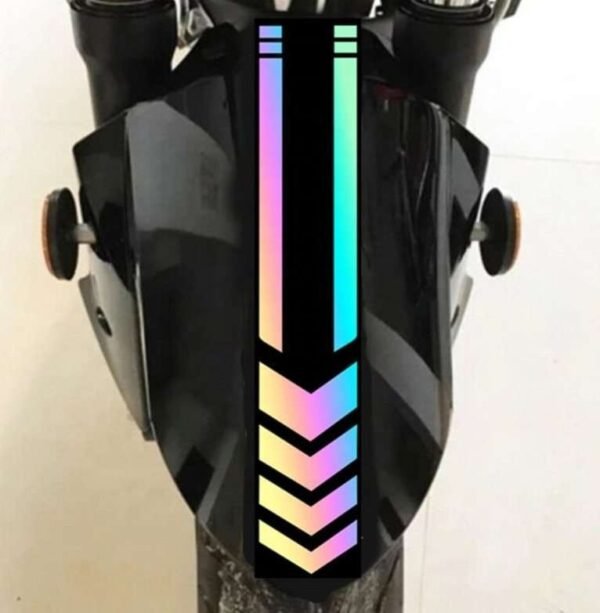 Illustrative multicolor arrow decal finish on a dark motorcycle fender