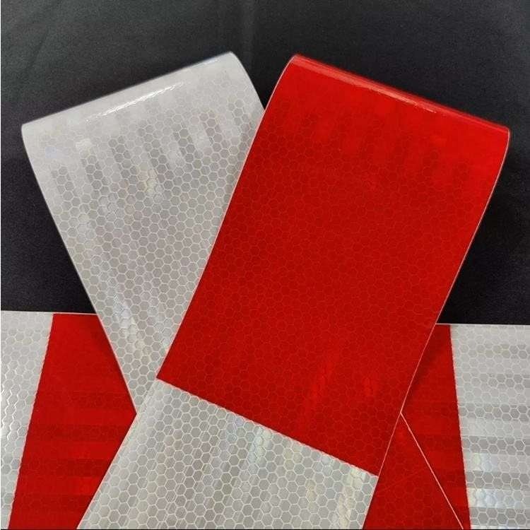 Red and white barrier marking material close-up in ambient light