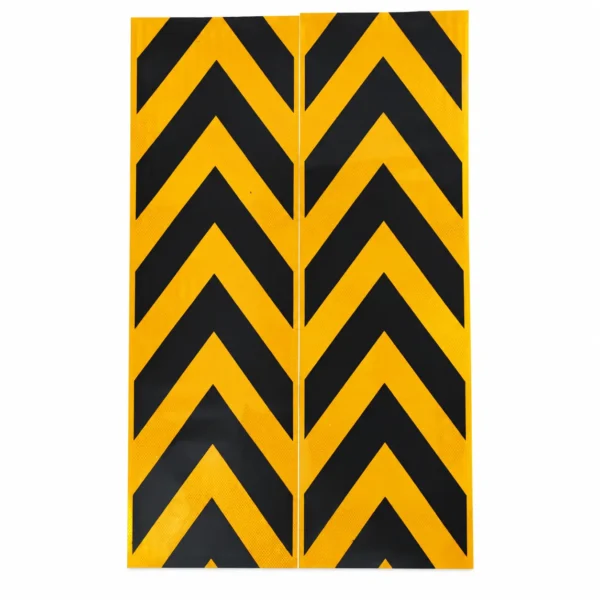 Two long yellow and black reflective arrow stickers positioned side by side