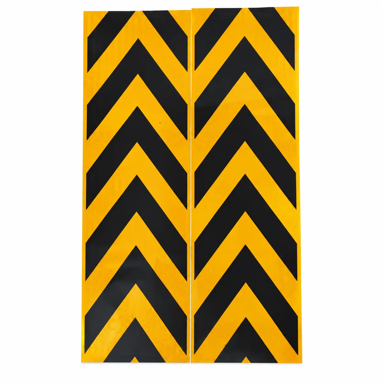 Two long yellow and black reflective arrow stickers positioned side by side