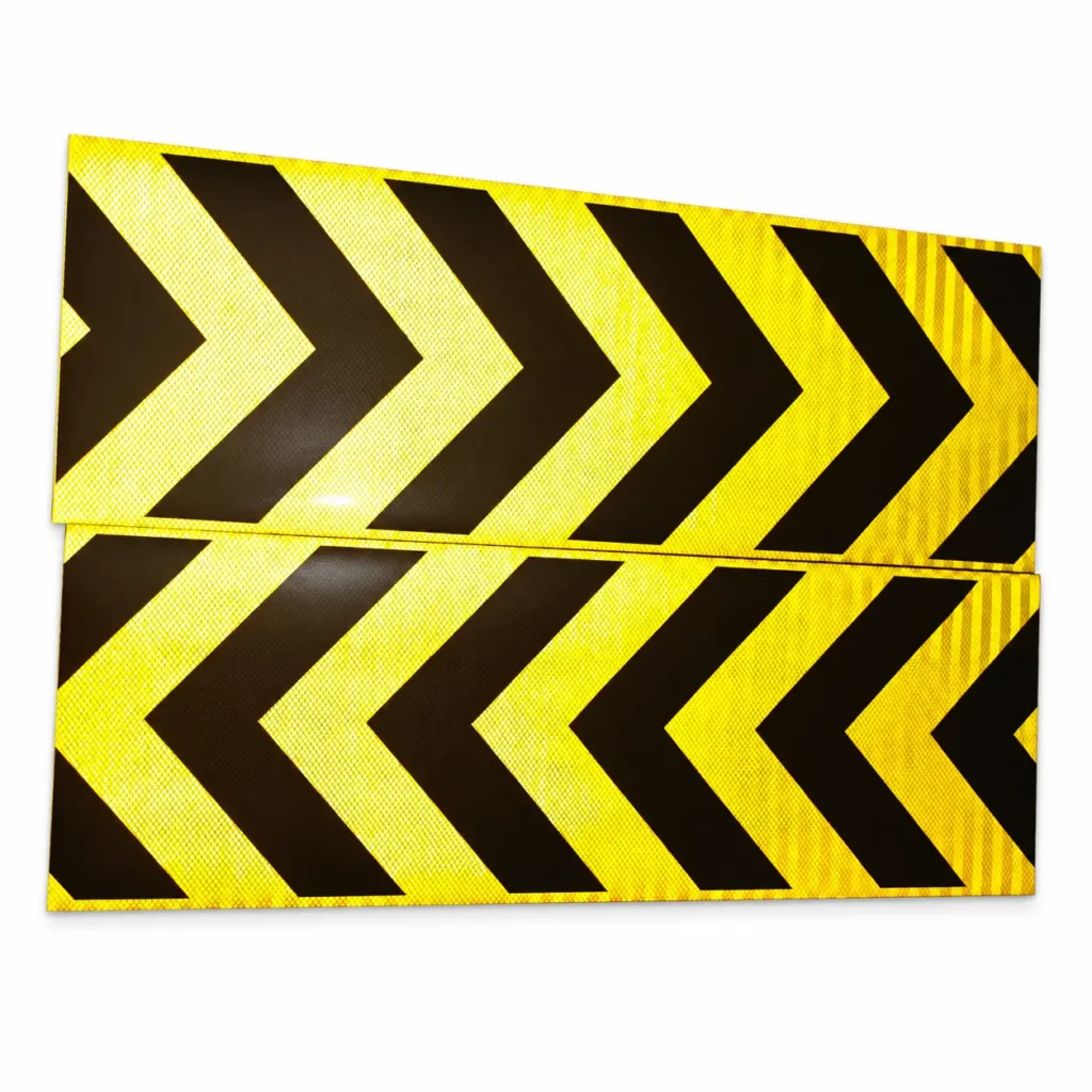 Yellow and black chevron sticker samples photographed under incident light